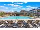 Community pool with lounging areas and scenic views, perfect for relaxation and recreation in a resort-style setting at 650 Agate Bridge St, Las Vegas, NV 89138