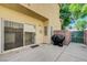 Cozy backyard patio with a grill and easy access to the home's interior via sliding glass doors at 6533 Sundown Heights Ave, Las Vegas, NV 89130