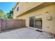 A private backyard patio with direct access from the kitchen/dining area via a sliding glass door at 6533 Sundown Heights Ave, Las Vegas, NV 89130
