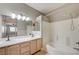 Bright bathroom featuring a double sink vanity, shower and tub combination with tile surround at 6533 Sundown Heights Ave, Las Vegas, NV 89130