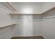 Walk-in closet offering ample storage space with multiple shelves and hanging rods at 6533 Sundown Heights Ave, Las Vegas, NV 89130