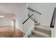 Inviting entryway featuring carpeted stairs and hardwood floors that lead to the kitchen at 6533 Sundown Heights Ave, Las Vegas, NV 89130