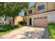 Inviting two-story townhome featuring a charming balcony and well-manicured landscaping at 6533 Sundown Heights Ave, Las Vegas, NV 89130