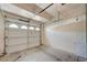 Garage interior with white door and some items on the floor at 6533 Sundown Heights Ave, Las Vegas, NV 89130
