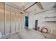 A tidy garage offering extra storage with shelving and a door leading to the house at 6533 Sundown Heights Ave, Las Vegas, NV 89130