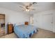 Bedroom featuring built in closet, ceiling fan and light neutral carpet at 775 Wigan Pier Dr, Henderson, NV 89002