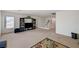 Large bonus room with neutral carpet, entertainment center, and railing at 775 Wigan Pier Dr, Henderson, NV 89002
