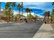 The community gate, framed by tall palm trees, ensures privacy and security for residents at 775 Wigan Pier Dr, Henderson, NV 89002