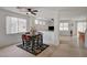 Inviting dining area featuring a dark wood table, ceiling fan, and a view into the living room at 775 Wigan Pier Dr, Henderson, NV 89002