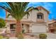 Inviting two-story home with a well-manicured front yard and attached two-car garage at 775 Wigan Pier Dr, Henderson, NV 89002