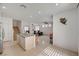 Inviting kitchen with an island, stainless steel appliances, and access to the living area at 775 Wigan Pier Dr, Henderson, NV 89002