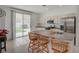 Bright kitchen featuring an island with seating and stainless steel appliances, perfect for cooking and entertaining at 775 Wigan Pier Dr, Henderson, NV 89002