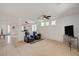 Spacious living room with an open floor plan, modern furniture, and plenty of natural light at 775 Wigan Pier Dr, Henderson, NV 89002