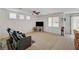 Comfortable living room with plush recliners, a large TV, and plenty of natural light at 775 Wigan Pier Dr, Henderson, NV 89002