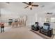Bright, open living space with modern recliners, seamlessly connecting to the kitchen and dining areas at 775 Wigan Pier Dr, Henderson, NV 89002