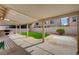 Covered patio with built in grill and lush artificial turf at 775 Wigan Pier Dr, Henderson, NV 89002