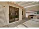 Covered patio with built in grill and sliding glass door to the house at 775 Wigan Pier Dr, Henderson, NV 89002
