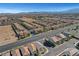 A broad aerial shot of the development showcasing community streets, landscaping, and nearby open desert terrain at 7853 Bethel Heights Ln, Las Vegas, NV 89113