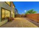 This cozy backyard features a gravel landscape, a small patio set, and a simple, low-maintenance design at 7853 Bethel Heights Ln, Las Vegas, NV 89113