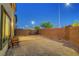 A cozy backyard featuring a gravel landscape, a small patio set, and a simple, low-maintenance design at 7853 Bethel Heights Ln, Las Vegas, NV 89113