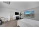 Comfortable bedroom featuring a window, mounted TV, and modern furnishings at 7853 Bethel Heights Ln, Las Vegas, NV 89113