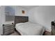 Cozy bedroom with a large window, neutral paint, and a comfortable bed at 7853 Bethel Heights Ln, Las Vegas, NV 89113