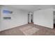 Bright and airy bedroom with carpet, two windows, and a closet at 7853 Bethel Heights Ln, Las Vegas, NV 89113