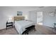 Airy bedroom with a modern bed and stylish decor at 7853 Bethel Heights Ln, Las Vegas, NV 89113