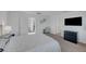 Bright bedroom with a contemporary design, closet, and view into a hallway at 7853 Bethel Heights Ln, Las Vegas, NV 89113