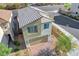 An aerial view of a modern home with a two-car garage, lush landscaping, and a corner lot location at 7853 Bethel Heights Ln, Las Vegas, NV 89113