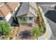 A modern two-story home on a corner lot, complete with an attached garage, attractive landscaping, and a welcoming facade at 7853 Bethel Heights Ln, Las Vegas, NV 89113