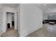 Hallway leading to the living room features tile flooring, neutral paint, and ample natural light at 7853 Bethel Heights Ln, Las Vegas, NV 89113