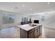 Bright living room with tile flooring, recessed lighting, access to the backyard, and an open floor plan at 7853 Bethel Heights Ln, Las Vegas, NV 89113