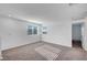 Well-lit loft area with plush carpeting, perfect for a second living area or office at 7853 Bethel Heights Ln, Las Vegas, NV 89113