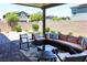 Relaxing covered patio with plush outdoor seating, perfect for entertaining or unwinding in style at 8186 Guadiano Ave, Las Vegas, NV 89113