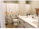Modern bathroom with double sink vanity and updated fixtures at 8186 Guadiano Ave, Las Vegas, NV 89113
