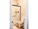 Modern bathroom featuring a walk-in shower with dark trim and a crisp white toilet at 8186 Guadiano Ave, Las Vegas, NV 89113