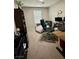 Comfortable bedroom featuring a work-from-home setup with a modern computer and ergonomic black chair at 8186 Guadiano Ave, Las Vegas, NV 89113