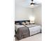 Cozy bedroom featuring a comfortable bed and a ceiling fan for added comfort at 8186 Guadiano Ave, Las Vegas, NV 89113