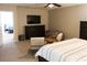 Bright bedroom featuring a comfortable bed, dresser, and sitting area for relaxing at 8186 Guadiano Ave, Las Vegas, NV 89113