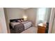 Neutral bedroom featuring a queen bed, bedside tables, and natural light at 8186 Guadiano Ave, Las Vegas, NV 89113