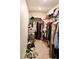 Walk-in closet featuring ample hanging space for clothes and accessory storage at 8186 Guadiano Ave, Las Vegas, NV 89113