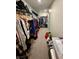 Spacious walk-in closet with ample storage, shelving, and hanging space at 8186 Guadiano Ave, Las Vegas, NV 89113