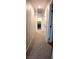 Hallway with doors leading to bedrooms and laundry room at 8186 Guadiano Ave, Las Vegas, NV 89113