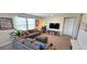 Comfortable living room featuring stylish sofas, vibrant pillows, and a flat screen TV at 8186 Guadiano Ave, Las Vegas, NV 89113