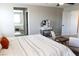 Spacious main bedroom featuring a vanity, comfortable bed and ensuite bathroom at 8186 Guadiano Ave, Las Vegas, NV 89113