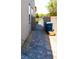 Side yard featuring pavers and gate at 8186 Guadiano Ave, Las Vegas, NV 89113