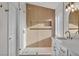 Stylish bathroom featuring a glass shower, accent wall, and white vanity at 8416 Kawala Dr, Las Vegas, NV 89128