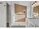 Modern bathroom with glass enclosed shower, white cabinets, and a custom wood accent wall at 8416 Kawala Dr, Las Vegas, NV 89128