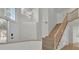 Inviting home foyer with a staircase and modern chandelier at 8416 Kawala Dr, Las Vegas, NV 89128
